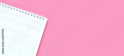 Calendar on pink background. Copy space