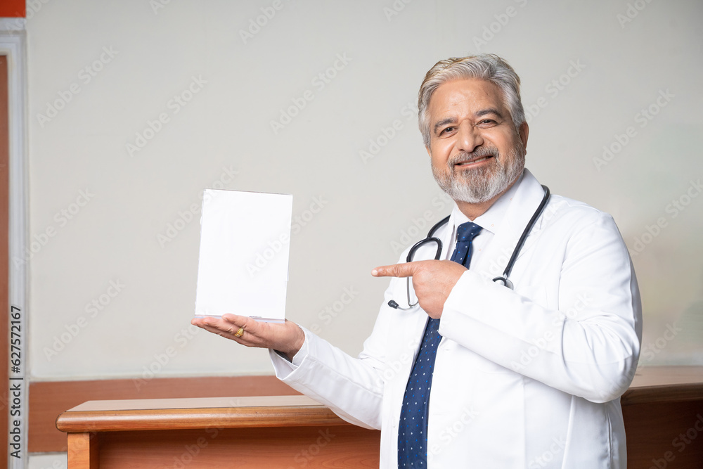 Senior doctor showing winning award at hospital Senior doctor showing winning award at hospital