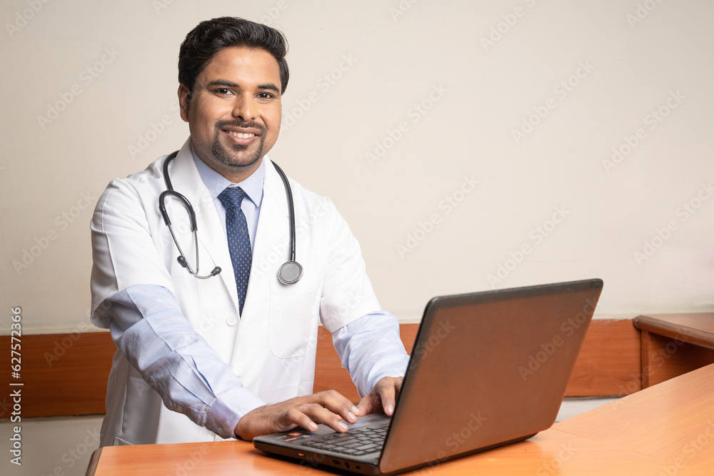 Doctor working on laptop in his medical office. Doctor working on laptop in his medical office.