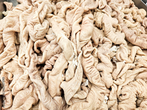 Slika na platnu Pile of Fresh Pig Large Intestine in a supermarket, Raw Pork Large Intestine