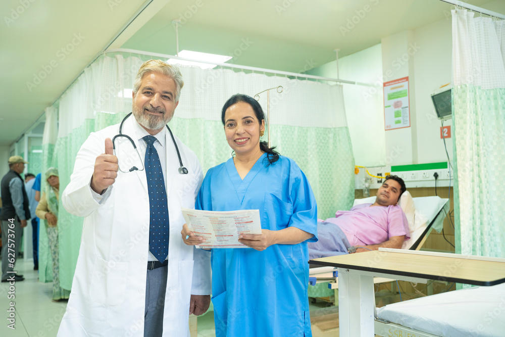 Doctor showing thumps up at hospital.