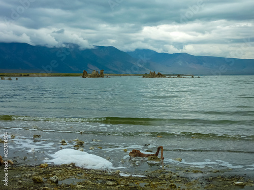 Scenic view of South Tufa rock formations at Mono Lake, near Lee Vining, Mono County, California, USA. Unique saline soda lake in Mono Basin, Sierra Nevada. Calcium carbonate minerals. Overcast photo