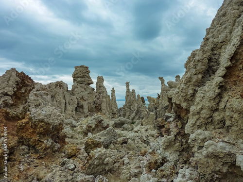 Scenic view of South Tufa rock formations at Mono Lake, near Lee Vining, Mono County, California, USA. Unique saline soda lake in Mono Basin, Sierra Nevada. Calcium carbonate minerals. Overcast