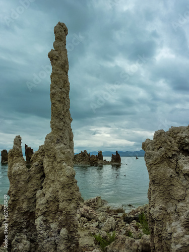 Scenic view of South Tufa rock formations at Mono Lake, near Lee Vining, Mono County, California, USA. Unique saline soda lake in Mono Basin, Sierra Nevada. Calcium carbonate minerals. Overcast photo