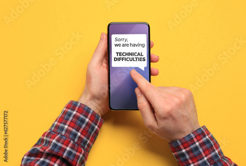 Canvas Print Man received message Sorry We Are Having Technical Difficulties on smartphone on