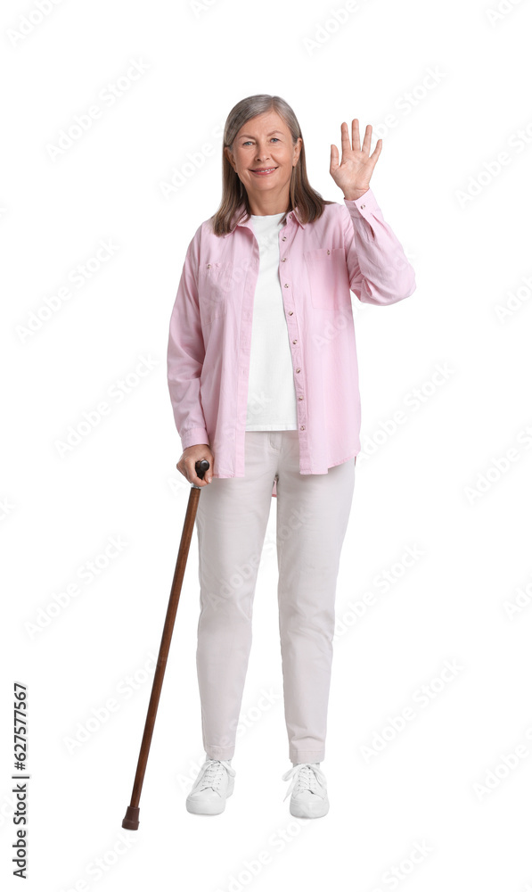 Senior woman with walking cane waving on white background Senior woman with walking cane waving on white background