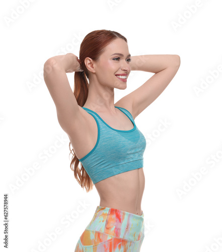 Young woman wearing sportswear on white background