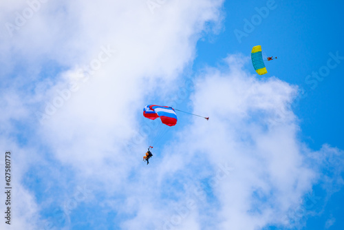 Parachute in the sky. Skydiver is flying a parachute in the blue sky