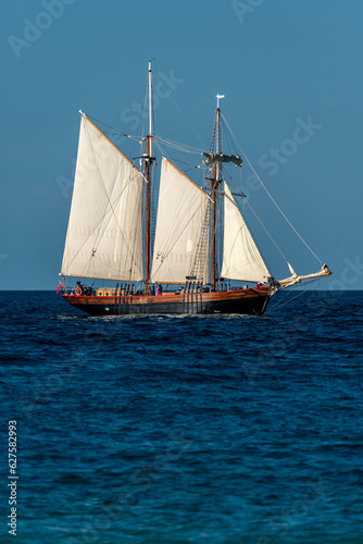 old wooden sail ship , on the ocean off the coast of cornwall uk , portrait photo