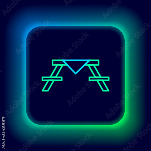 Glowing neon line Picnic table with benches on either side of the table icon isolated on black background. Colorful outline concept. Vector