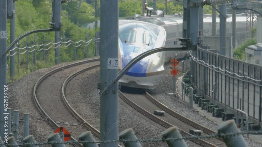Hokuriku Shinkansen leaving Karuizawa Station on its way towards Tokyo on a hot summer day. Taken on July 22, 2023.