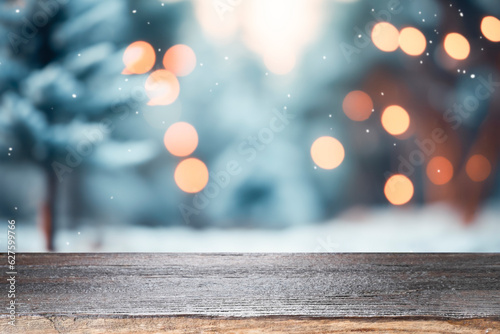 Empty wooden table for present product on christmas tree and bokeh blur background.