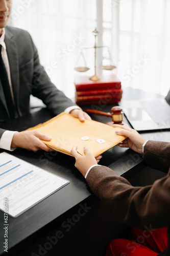 Business and Male lawyer or judge consult having team meeting with client, Law and Legal services concept.Customer service good cooperation in office