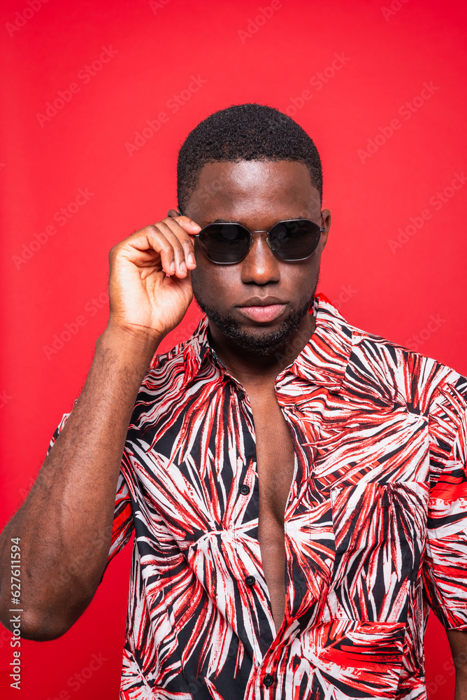 Stylish black man in sunglasses tropical shirt Stylish black man in sunglasses tropical shirt