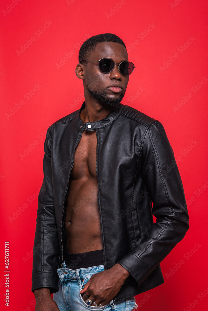 Confident black macho man with unbuttoned jacket Confident black macho man with unbuttoned jacket