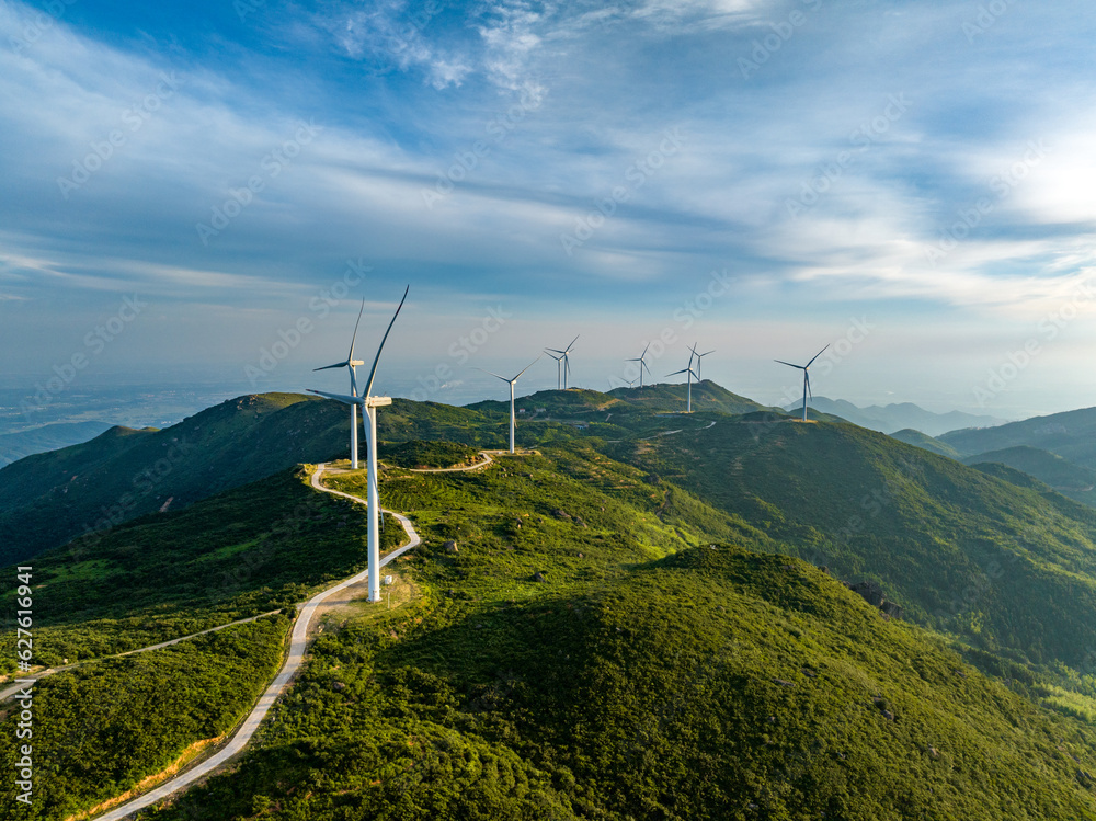 Wind farm on the mountain, blue sky and white clouds Wind farm on the mountain, blue sky and white clouds