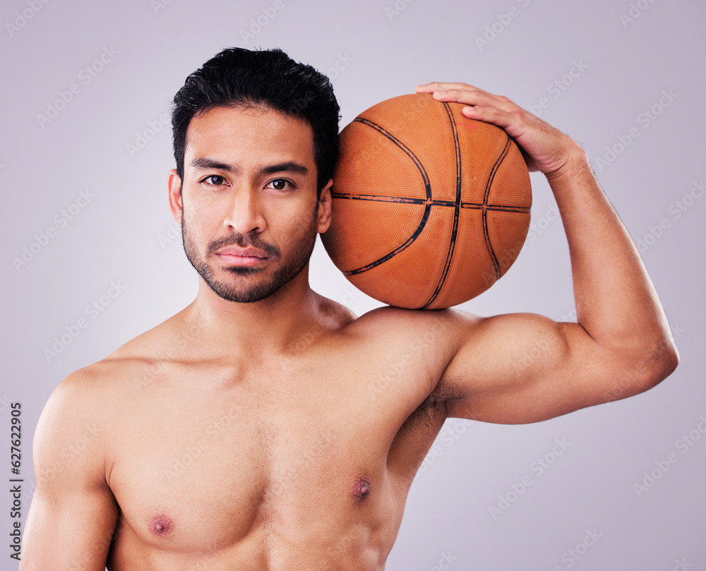 Portrait, basketball and body with a sports man in studio on a gray background for training or a game. Fitness, muscle or mindset and a shirtless young male athlete holding a ball with focus Portrait, basketball and body with a sports man in studio on a gray background for training or a game. Fitness, muscle or mindset and a shirtless young male athlete holding a ball with focus