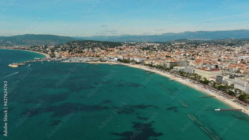 Beautiful aerial panoramic view of cityscape of Cannes, Palm Beach, French Riviera. Flying above of the Croisette Beach, Alpes Maritimes department, Cote d'azur - Mediterranean sea, France, Europe 4K Beautiful aerial panoramic view of cityscape of Cannes, Palm Beach, French Riviera. Flying above of the Croisette Beach, Alpes Maritimes department, Cote d'azur - Mediterranean sea, France, Europe 4K