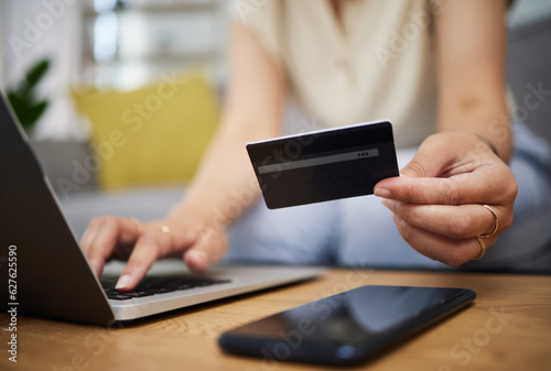 Hands, credit card and ecommerce on laptop in home for digital payment, fintech password and online shopping. Closeup of person, computer and customer banking for financial bills, budget and account