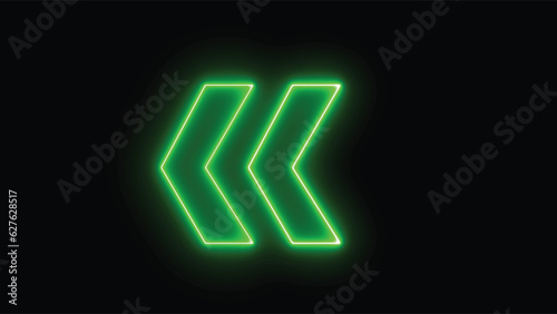 Bright green arrow for evacuation direction illuminated indoors. neon left direction in the night. Flashing direction indicators.