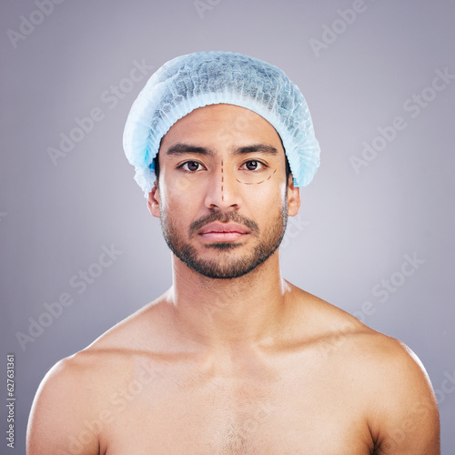 Portrait, skincare and man with plastic surgery, change and beauty enhancement against a grey studio background. Face, male person and model with transformation, facial dermatology and aesthetic