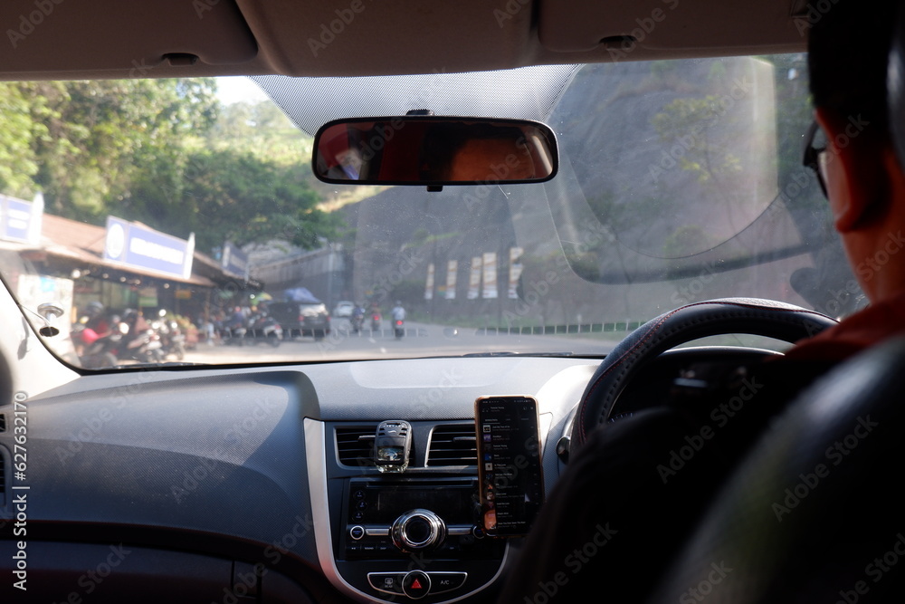 View of a man driving car on the street