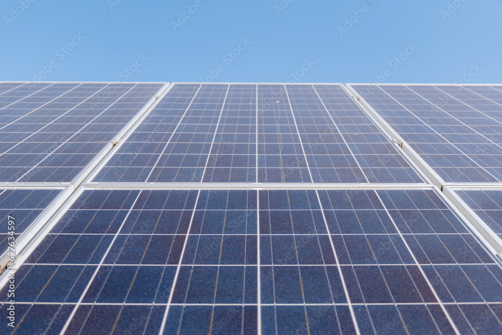 Solar Panels Against The Deep Blue Sky. Solar panels on the sky background Solar Panels Against The Deep Blue Sky. Solar panels on the sky background
