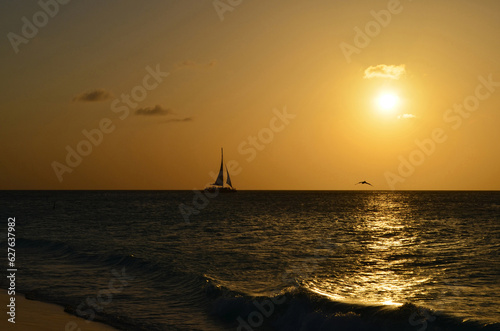 Gorgeous Sun Setting with a Silhoetted Sailboat