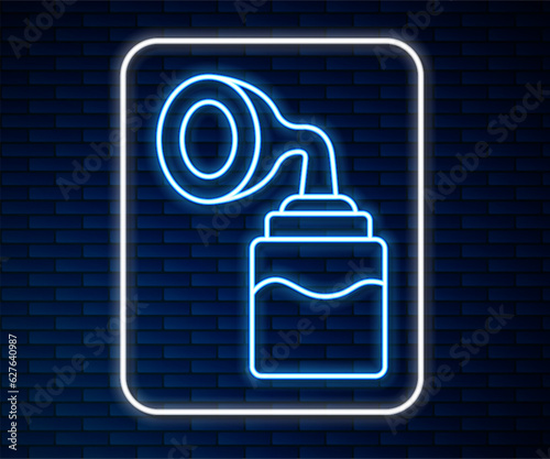 Glowing neon line Breast pump icon isolated on brick wall background. Vector