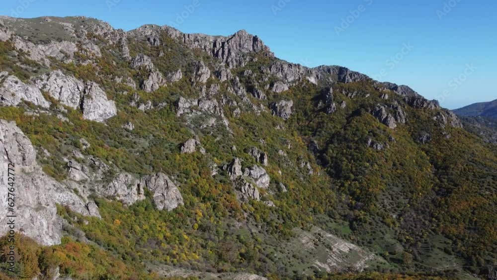 Jagged Talysh Mountains with fall color trees on slopes, Azerbaijan Jagged Talysh Mountains with fall color trees on slopes, Azerbaijan