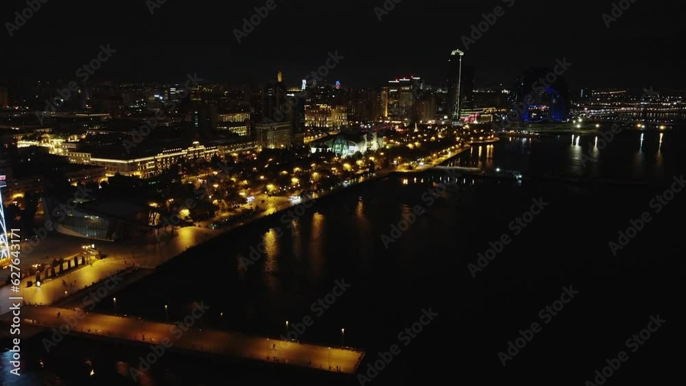 Aerial: Illuminated Caspian waterfront of Baku city in Azerbaijan Aerial: Illuminated Caspian waterfront of Baku city in Azerbaijan