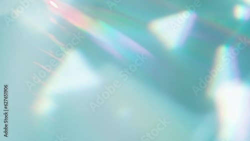 Rainbow Decay from the Lens. Loop. The optical lens system creates a series of bright, changing geometric highlights on a light surface