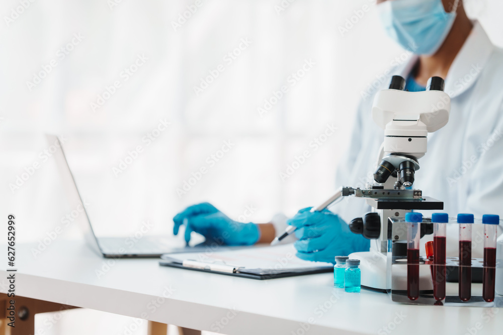 African American female technician testing blood sample in lap. blood test is one of the most common tests healthcare provider uses to monitor your overall health or help diagnose medical condition. African American female technician testing blood sample in lap. blood test is one of the most common tests healthcare provider uses to monitor your overall health or help diagnose medical condition.