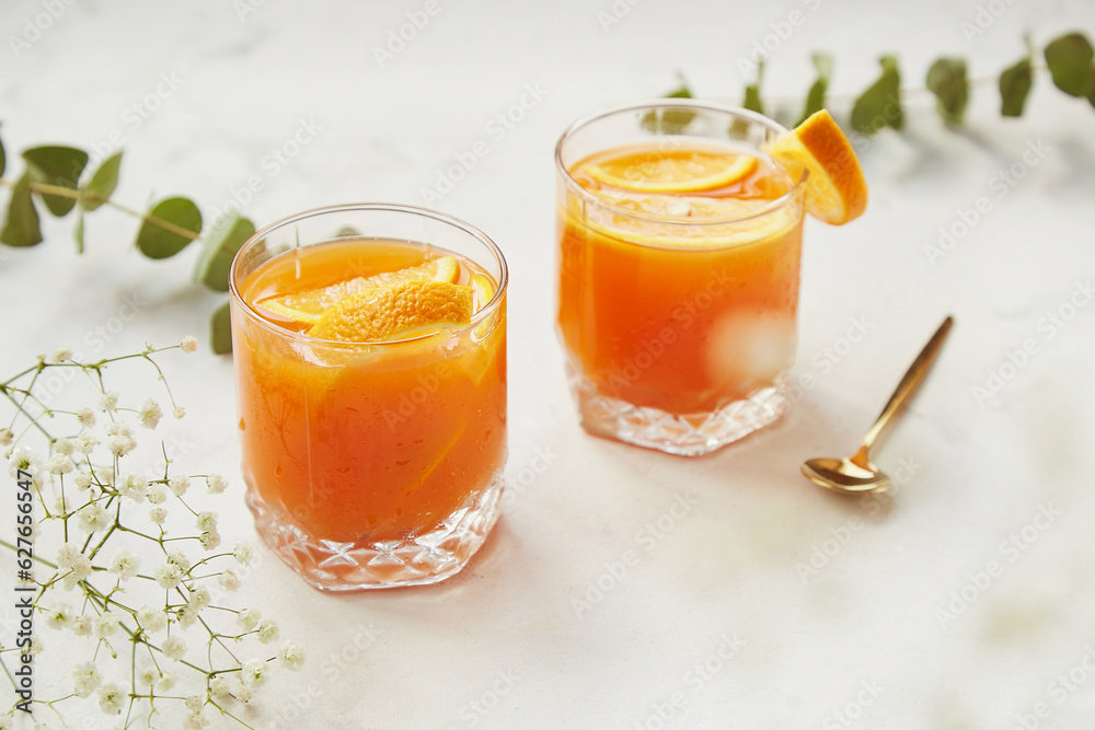 Fresh non alcoholic refreshing cocktail with orange, grapefruit, lemon. Detox vitaminized beverage, refreshing drinks, low alcohol mocktails, summer party concept. Shadow and sunlight Fresh non alcoholic refreshing cocktail with orange, grapefruit, lemon. Detox vitaminized beverage, refreshing drinks, low alcohol mocktails, summer party concept. Shadow and sunlight