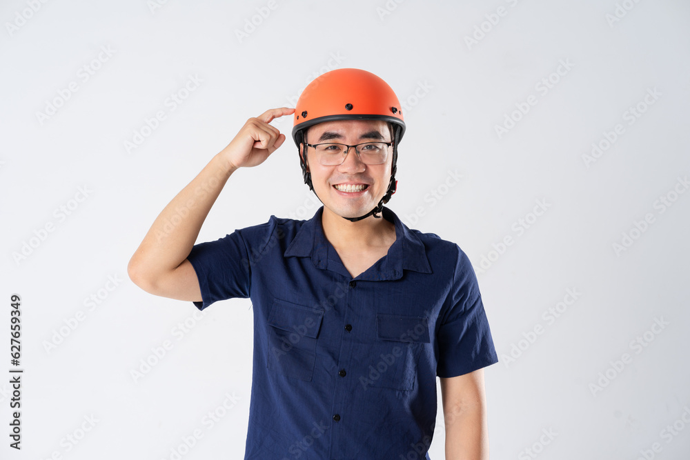 man wearing orange helmet on white background