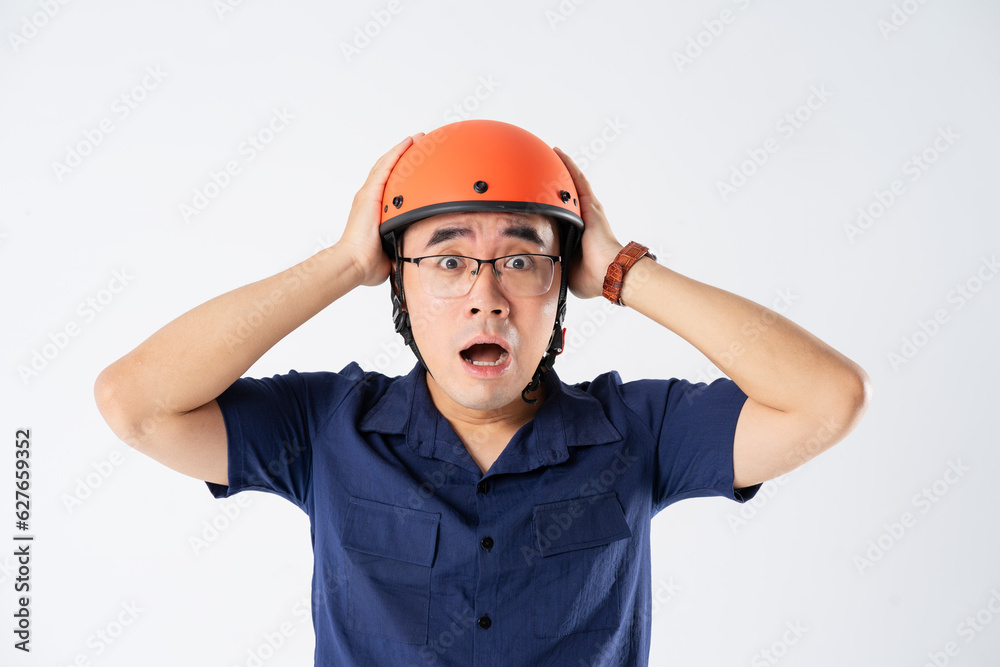 man wearing orange helmet on white background man wearing orange helmet on white background