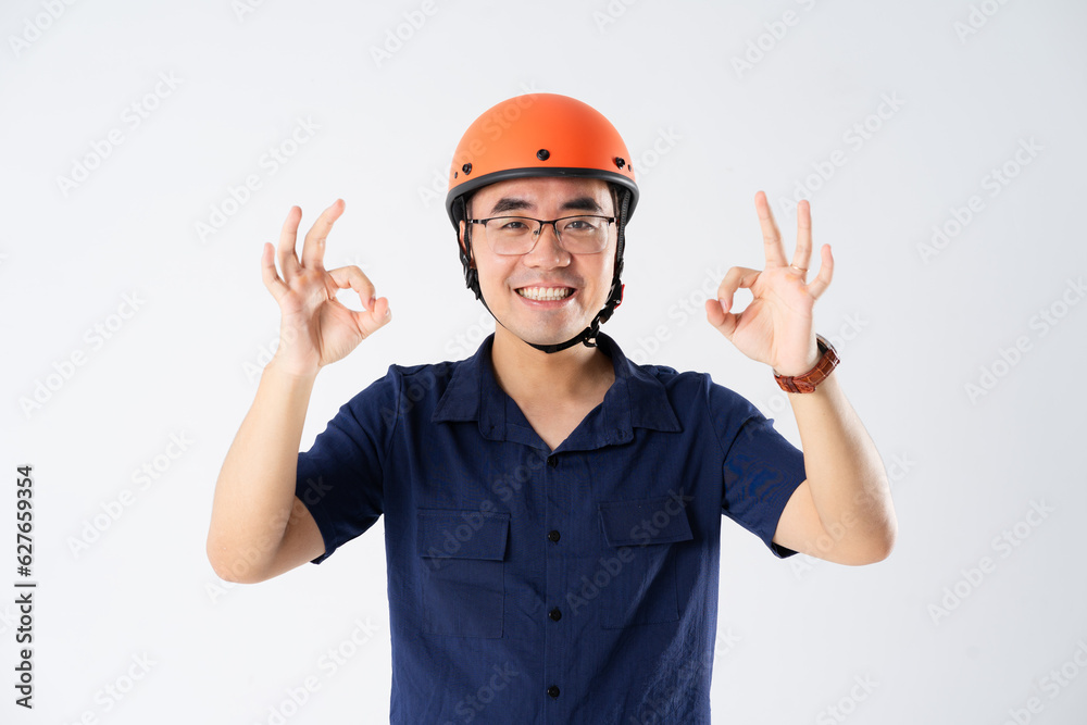 man wearing orange helmet on white background man wearing orange helmet on white background