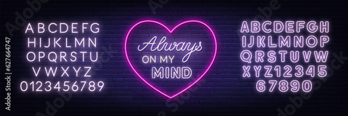 Always on my mind neon lettering on brick wall background.