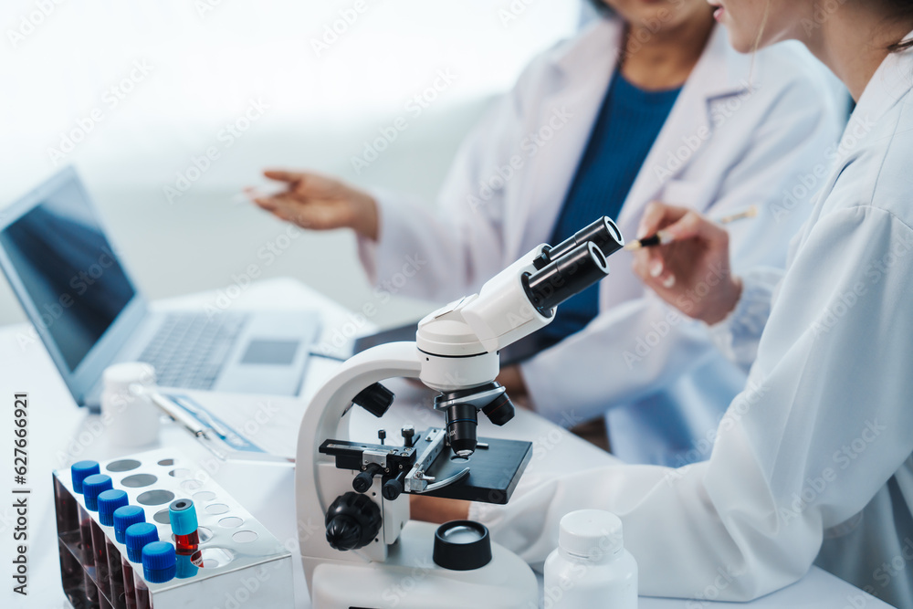 Health care researchers working in life science laboratory, Teaching in labs - Requiring students to record their laboratory methods and results as a running record of their laboratory work. Health care researchers working in life science laboratory, Teaching in labs - Requiring students to record their laboratory methods and results as a running record of their laboratory work.