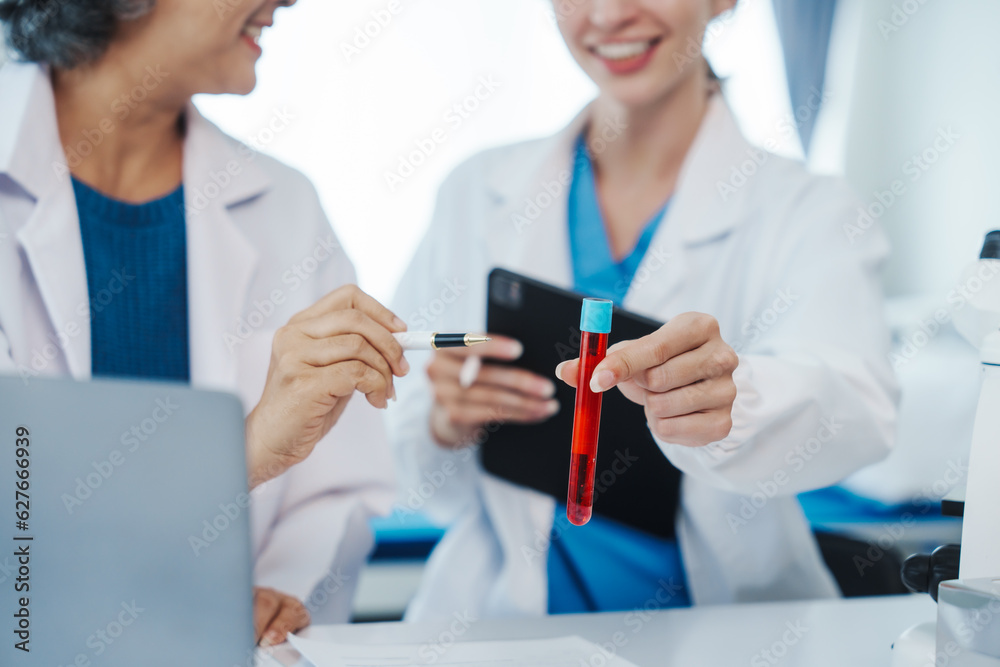 Health care researchers working in life science laboratory, Teaching in labs - Requiring students to record their laboratory methods and results as a running record of their laboratory work. Health care researchers working in life science laboratory, Teaching in labs - Requiring students to record their laboratory methods and results as a running record of their laboratory work.