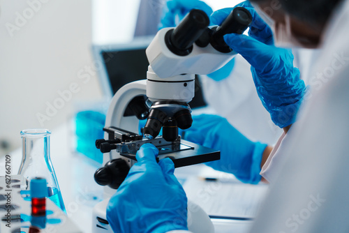 Health care researchers working in life science laboratory, Teaching in labs - Requiring students to record their laboratory methods and results as a running record of their laboratory work.