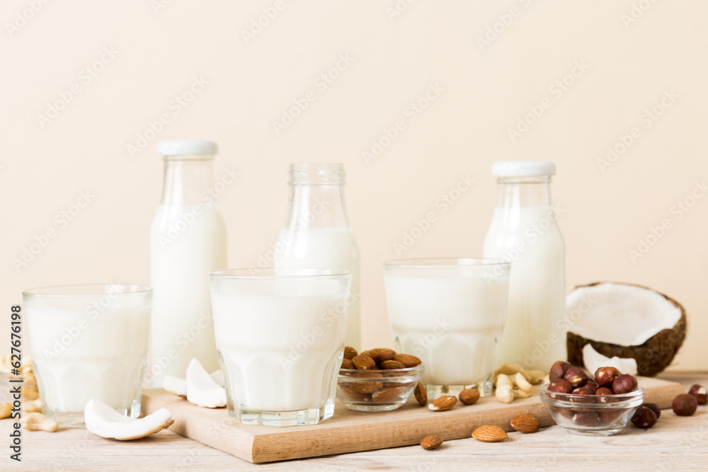 Set or collection of various vegan milk almond, coconut, cashew, on table background. Vegan plant based milk and ingredients, top view Set or collection of various vegan milk almond, coconut, cashew, on table background. Vegan plant based milk and ingredients, top view