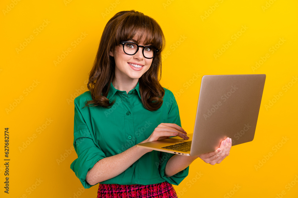 Photo of pretty cute lady wear green shirt communicating instagram twitter telegram facebook isolated yellow color background Photo of pretty cute lady wear green shirt communicating instagram twitter telegram facebook isolated yellow color background