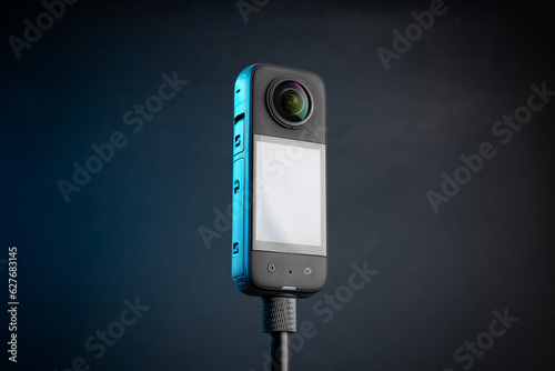 Modern 360 degree digital camera on black background
