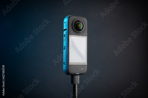 Modern 360 degree digital camera on black background