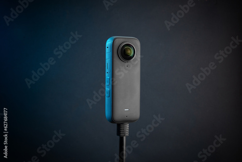 Modern 360 degree digital camera on black background
