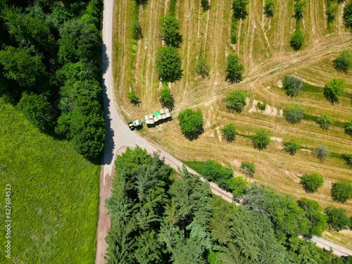 Working in the field on a tractor, harvesting