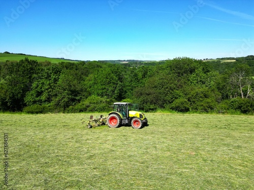 Working in the field on a tractor, harvesting