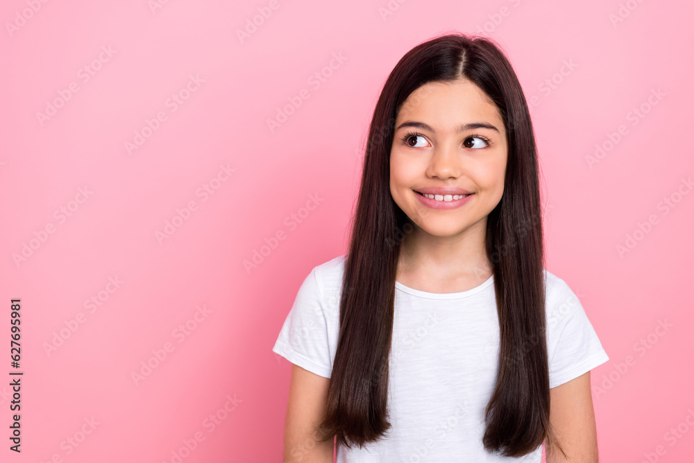 Photo portrait of adorable schoolkid female look empty space model shopping dressed stylish white clothes isolated on pink color background Photo portrait of adorable schoolkid female look empty space model shopping dressed stylish white clothes isolated on pink color background