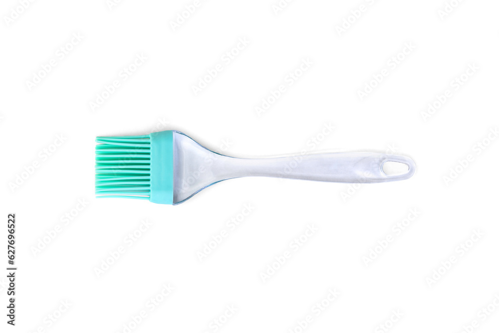 Green silicone cooking brush on a white background. Green silicone cooking brush on a white background.